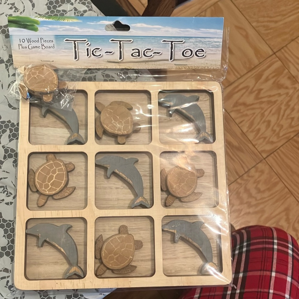 New & unopened 10 wooden piece tic tac toe game. Perfect thoughtful holiday gift